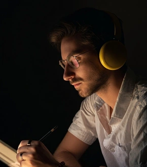 Virand, creator of Whisper, drawing at his desk.